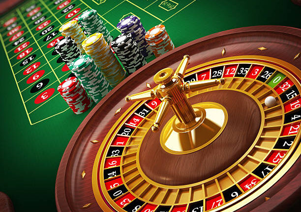 Roulette wheel and casino chips on the table.Similar images: